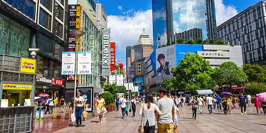 Busy Shanghai pedestrian street used for Minhang crowd-planning context