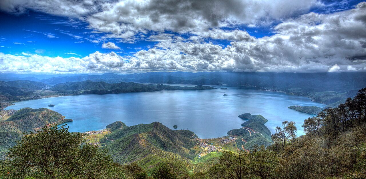 Traditional Boat & Island View during the 4-Day Slow Lugu Lake Discovery itinerary
