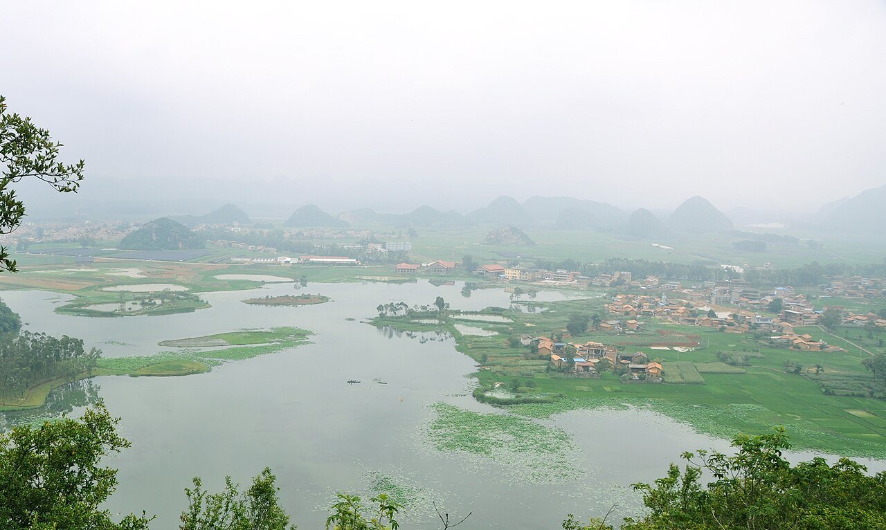 Qinglong Mountain Panorama during the 4-Day Puzhehei Cycling & Lake Journey itinerary
