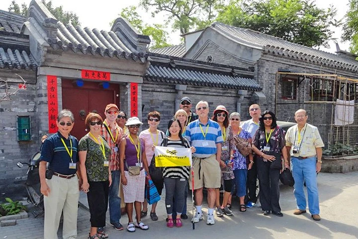 A travel group visiting a Beijing hutong